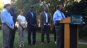 City Commissioner Curtis Richardson (right) speaks at an announcement for the upcoming Longest Table event, the fourth of its kind. 