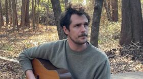 Joseph Terrell holding a guitar