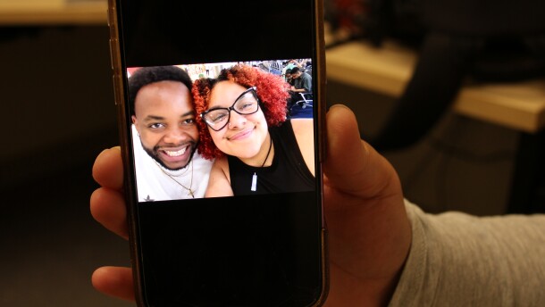 Jaylee Shopshire-Nsuka holds up a photo with her husband, Delfino Nsuka, on Sunday, Jan. 25, 2025. Shopshire-Nsuka says the two met about eight years ago while they were both students at Lewiston High School.