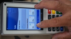 A shopper makes a purchase with food stamps on Monday, Oct. 27, 2025, in Los Angeles. (AP Photo/Damian Dovarganes)