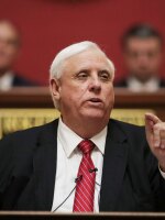 West Virginia Gov. Jim Justice delivers his annual State of the State address at the state Capitol in Charleston, W.Va., in January. Justice and his family own coal mining companies that have agreed to pay the government more than $5 million in delinquent mine safety fines, the Justice Department says.