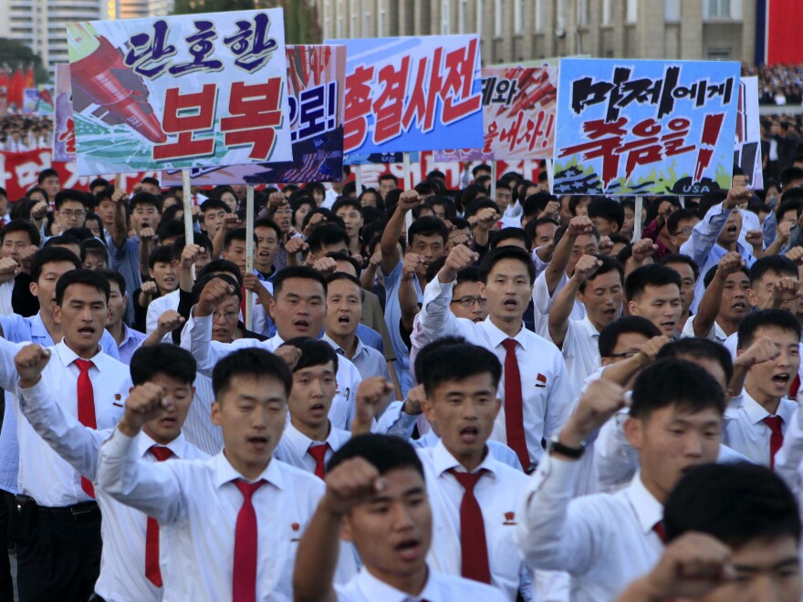 North Koreans gather at Kim Il Sung Square to attend a mass rally against America on Saturday in Pyongyang.