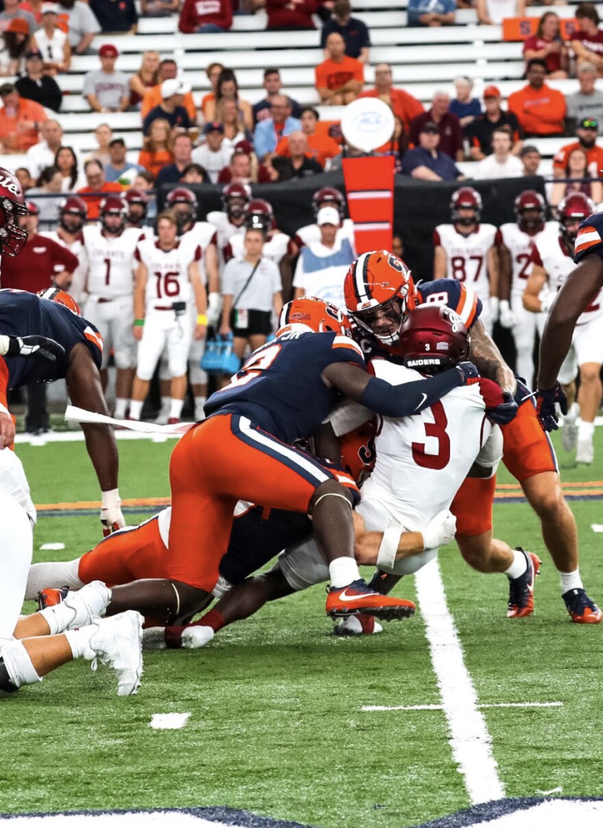 Syracuse's defense wraps up a Colgate rusher in SU's week one win over Colgate.