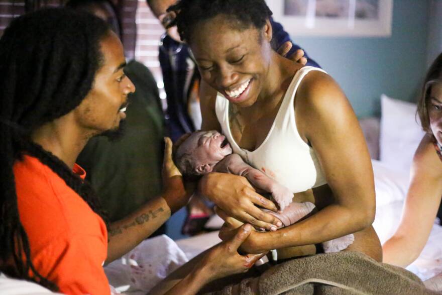 Tiffany Casby cradles her newborn son Zayne, shortly after birthing him at Embrace Midwifery & Birth Center in Richmond in 2017.