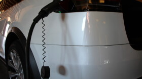 An electric vehicle being refueled.