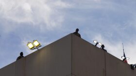 Federal officers atop the ICE building in Portland on Sunday, Sept. 28, 2025. Federal lawyers are appealing a decision by a federal judge in Oregon that blocked President Donald Trump from deploying National Guard troops to the city.