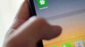 Nextdoor, the hyper local social network, is seen on a smartphone screen in Washington, DC.
