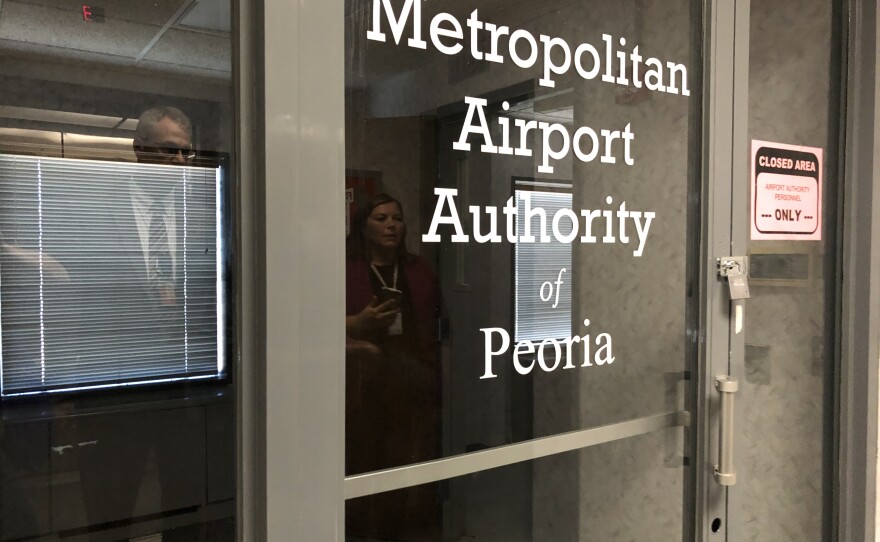 A padlock secures the door to the former Metropolitan Airport Authority offices on a vacated floor of the air traffic control tower at Peoria International Airport.