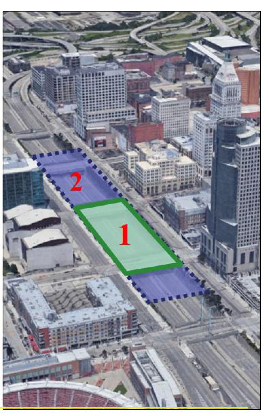 green and blue boxes labeled 1 and 2 placed over an image of a highway running through a city