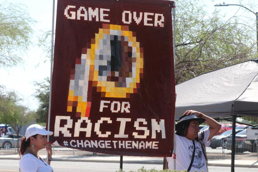 Members of Arizona to Rally Against Native Mascots protest the Washington mascot outside State Farm Stadium in Glendale. The Redskins faced the Cardinals on Sunday.