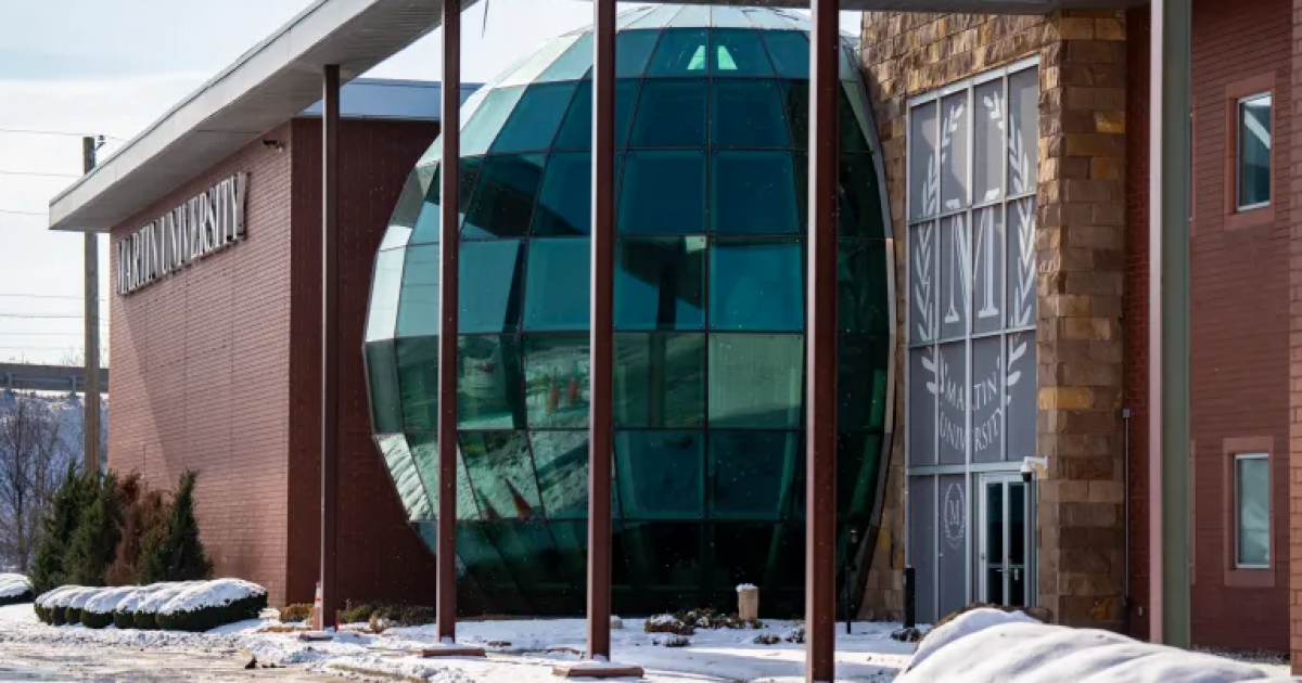 Snow covers the entrance to a Martin University building on Dec. 16, 2025, in Indianapolis. The university will close at the end of the current semester, as announced in a release on Dec. 9, 2025.