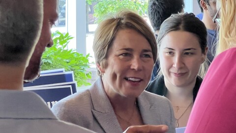 Massachusetts Attorney General Maura Healey chats with supporters during a campaign stop in North Adams. The Democrat is running for governor this year.