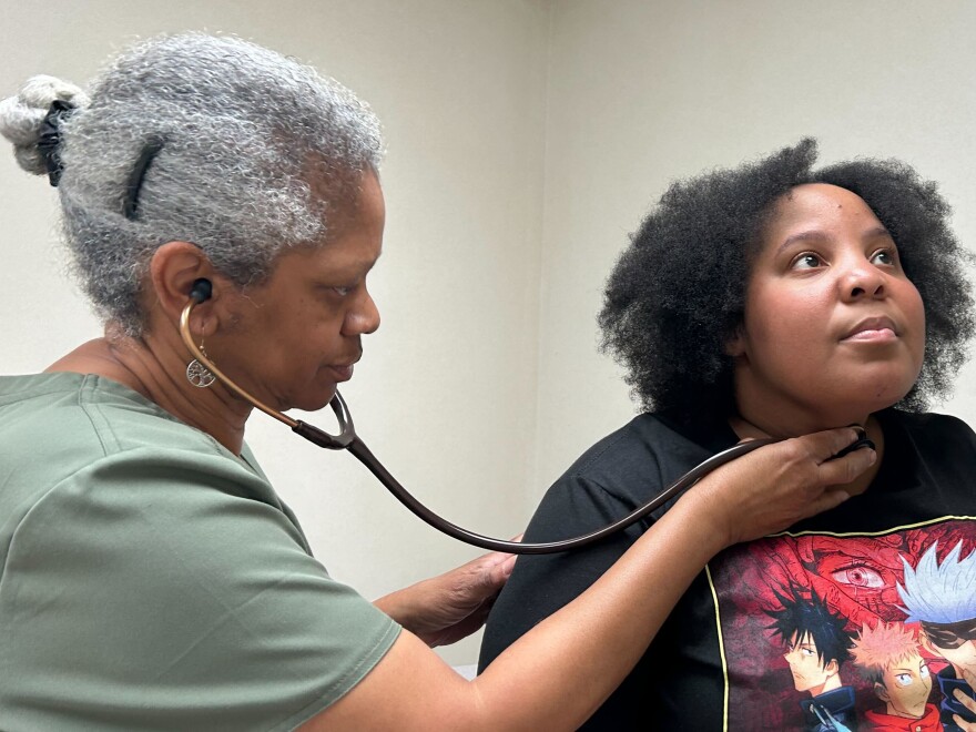 Dr. Terry Vester examines Charity Hodge at Vester's clinic in LaFayette, Alabama. Vester and her husband are the only primary care doctors in the community.