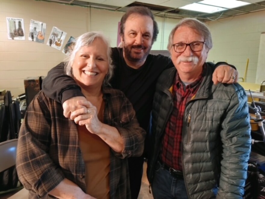 Cathy Currier, left, Michael Johnathan, center, and Al White are among those restoring instruments for the WoodSongs Tornado Relief Effort.