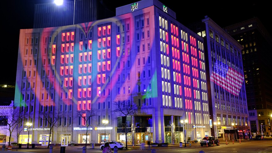The Indianapolis Power & Light Company downtown headquarters is light up following a light display, Wednesday, March 25, 2020, in Indianapolis. The light display presentation illuminates love and hope to the world from the heart of Downtown Indianapolis. Gov. Eric Holcomb ordered state residents to remain in their homes to slow the spread of COVID-19.