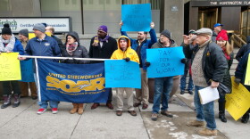 Protesters at Sen. Rob Portman's office in downtown Columbus rally against the government shutdown.