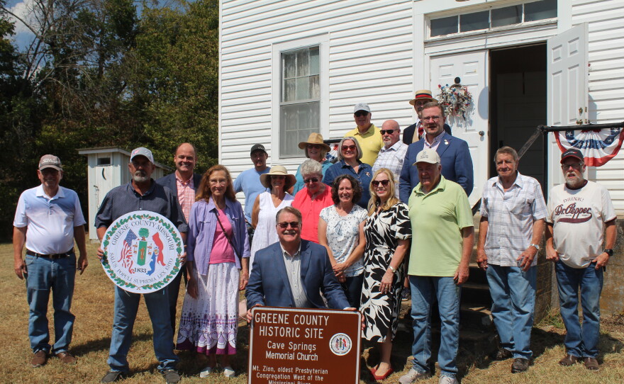 Greene County Commissioners and those involved with Cave Spring Memorial Church gather for a photo after a rededication on September 8, 2026.