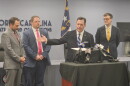 N.C. State Board of Elections executive director Sam Hayes, center, held a news conference Thursday about the start of mail-in absentee voting.