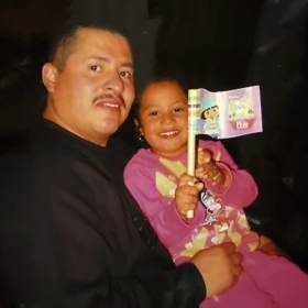 The author as a toddler and her father at their former home in Indiana.