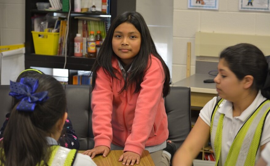 photo of a young girl in a classroom