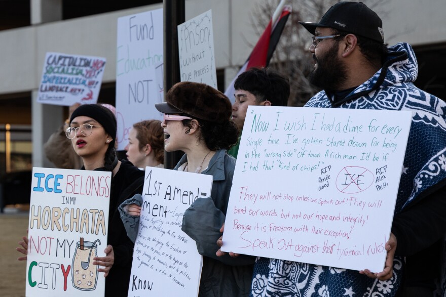 Juaquin Hinojos stands with other protestors.
