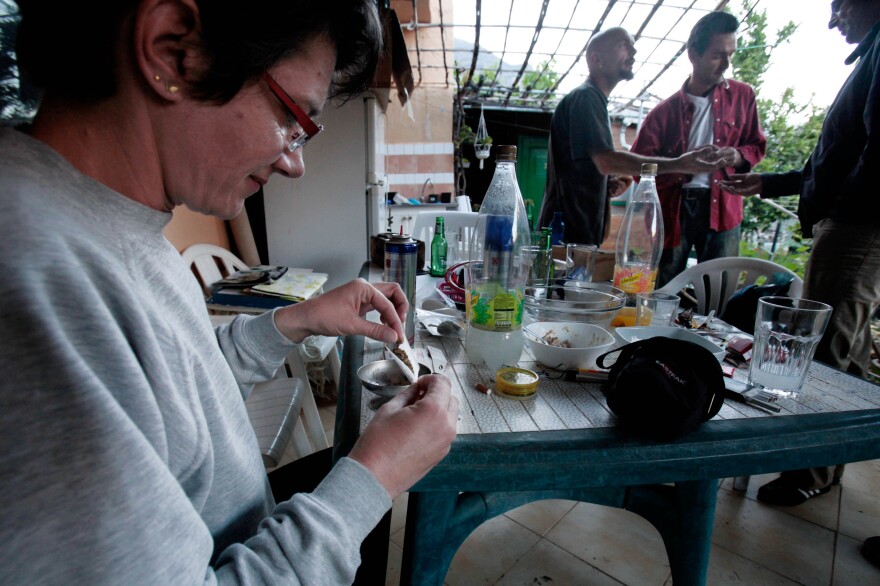 Eliane Detraz, a 42-year-old Swiss national member of the Sibaratas Med Can club, rolls a joint at the plantation of the association in Spain's Canary Islands in April 2013.