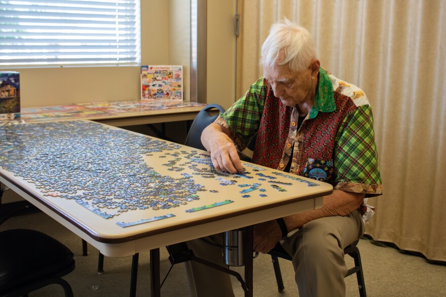 Butch Halbritter works on a puzzle at the Washington Terrace Senior Center, Aug. 6, 2024.