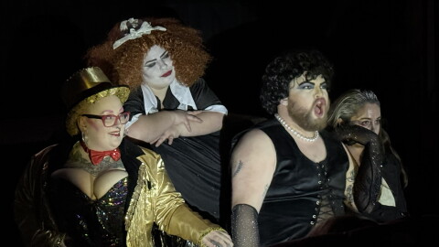 From left, Chyna Morgan Mahan, Courtney Vinzant and Logan Parks play Magenta, Columbia and Dr. Frank-N-Furter in a shadow cast production of "The Rocky Horror Picture Show" on Thursday, Oct. 29, 2026 near Soldotna, Alaska.