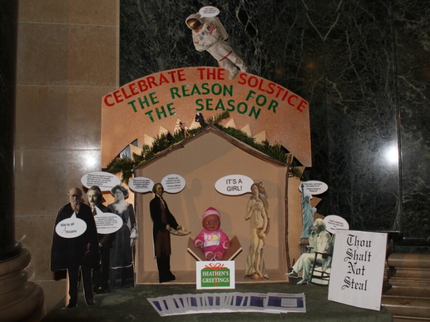 An "alternative Nativity scene" was set up at the Wisconsin State Capitol by the secular, nontheist organization Freedom from Religion Foundation when its request that a traditional creche be removed was not met.