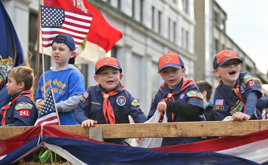 Cub Scouts toss candy during the parade.