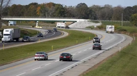 Cars drive on the Indiana Toll Road in northern Indiana