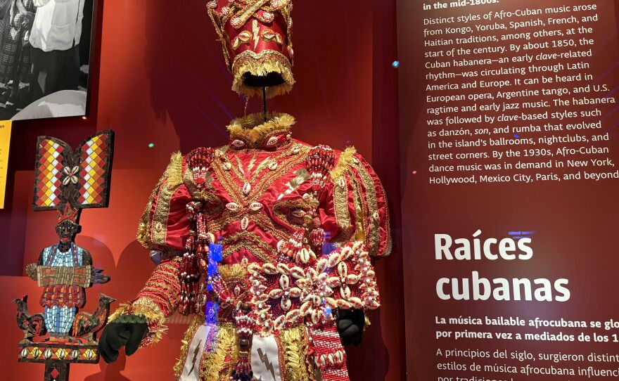 The museum asked three adherents of Santería, an Afro-Cuban religion, to create regalia that honors Changó, the deity of drumming and dance. A piece like this would be used in religious ceremonies.
