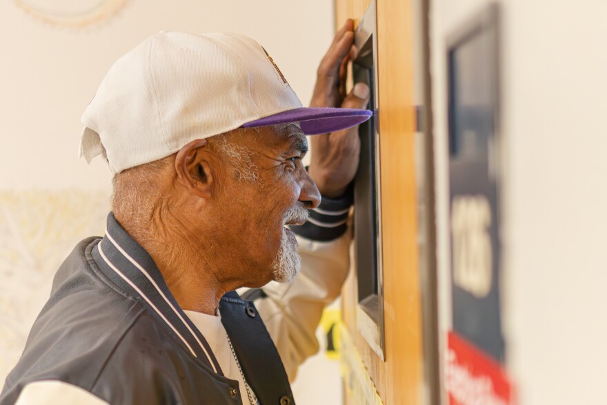 Donald Turnetine, who graduated from Mathewson in 1969, looks into a classroom that was built after his graduation. After Turnetine's graduation, Mathewson was closed and many students were bussed to different schools as part of integration efforts. "I'm one of the last legendaries that was bused when they started cross-busing," Turnetine said.