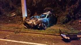 Two Gainesville citizens pulled a man out of a burning car Thursday night. The car rolled several times before hitting a concrete pole. (Courtesy of Gainesville Fire Rescue.)