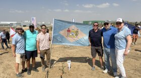 House Republican Whip Jeff Spiegelman (R-Clayton), State Sen. Darius Brown (D-New Castle), State Sen. Trey Paradee (D-Dover), Deputy Director General of the Israeli Ministry of Foreign Affairs Lior Haiat and State Rep. Melanie Ross Levin (D-Brandywine) pose with a Delaware state flag and a newly planted tree on Sept. 16, 2025, in Ofakim, Israel.