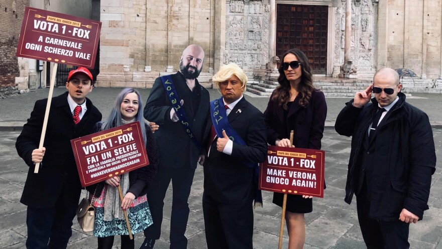 From left to right, an impersonation of Barron Trump in a Make America Great Again hat, Ivanka Trump, a cardboard cutout of Ridolfi when not in costume, Ridolfi in a Donald Trump costume, a Melania Trump look-alike and a man in a Secret Service costume.