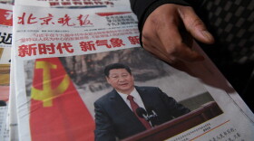 Newspapers featuring China's President Xi Jinping are pictured at a newsstand in Beijing on Oct. 26, 2017, a day after he was introduced at China's new Politburo Standing Committee, the nation's top decision making body. (Greg Baker/AFP/Getty Images)