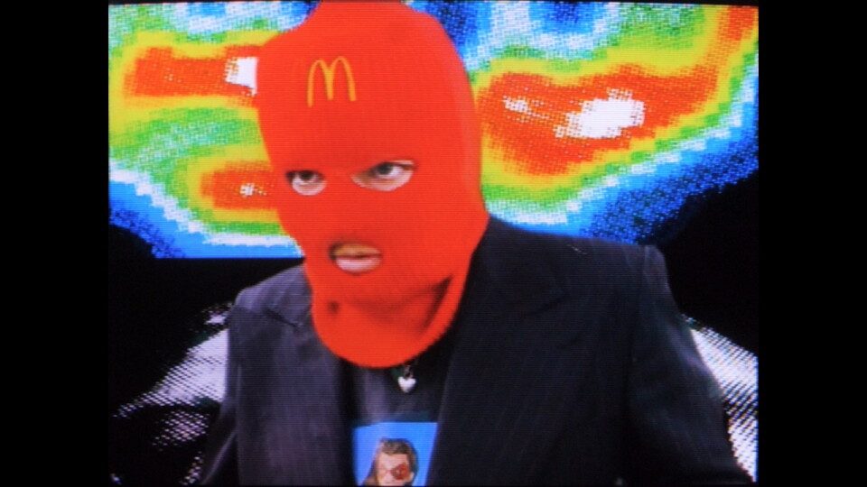 a person wearing a McDonalds balaclava 