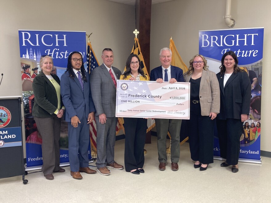 Maryland Democrat Senator Chris Van Hollen presents Frederick County leaders with a ceremonial $1 million check for renovations to a senior center.