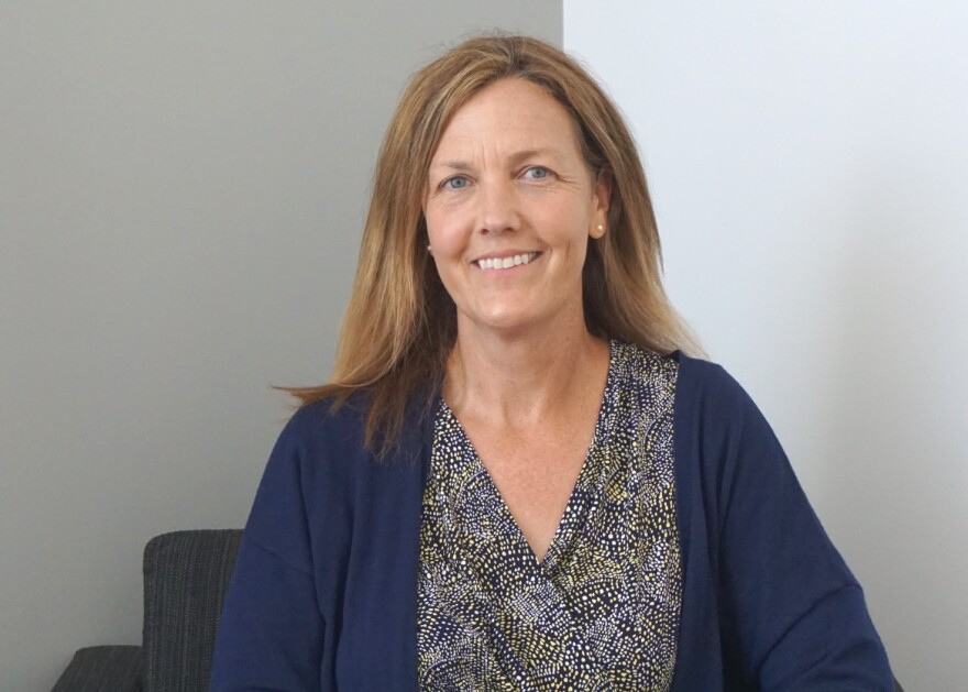 Beth Huebner, seated for a portrait, is a professor of criminology and criminal justice.