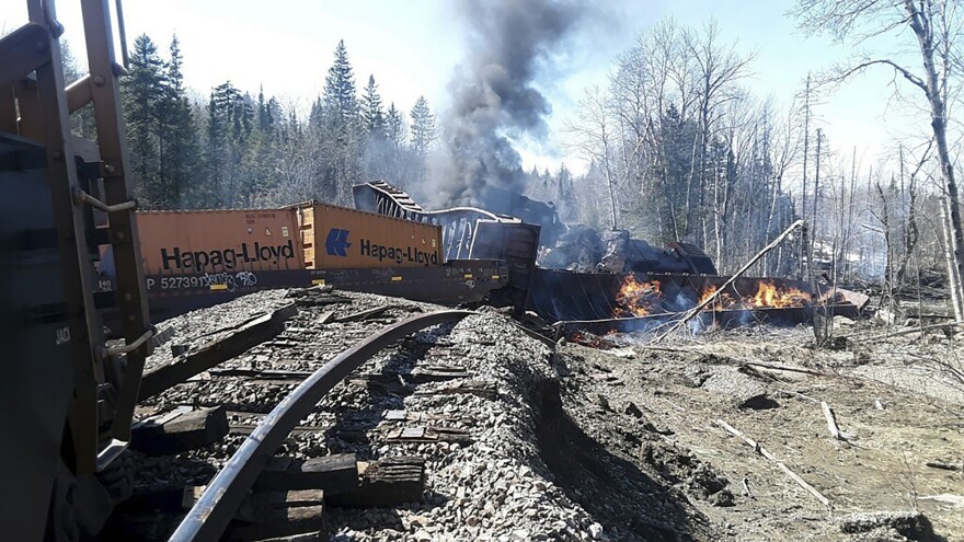 FILE - In this photo provided by the Jackman-Moose River Fire & Rescue Department, rubble burns after several cars on a freight train derailed in rural Maine, April 15, 2023.