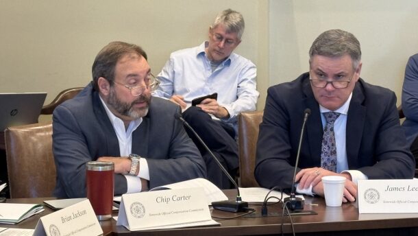 David ‘Chip’ Carter and James Leewright, members of the Statewide Official Compensation Commission, discuss salaries for Oklahoma statewide elected officials during a Wednesday meeting at the Capitol.