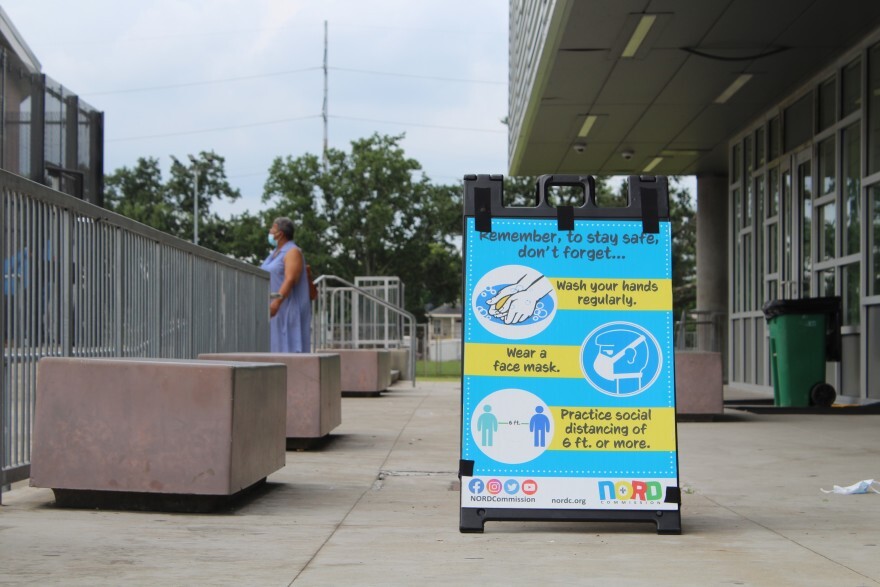 A sign at Rosenwald Recreation Center in Central City reminds visitors to wash their hands, mask up and social distance. July 31, 2021.