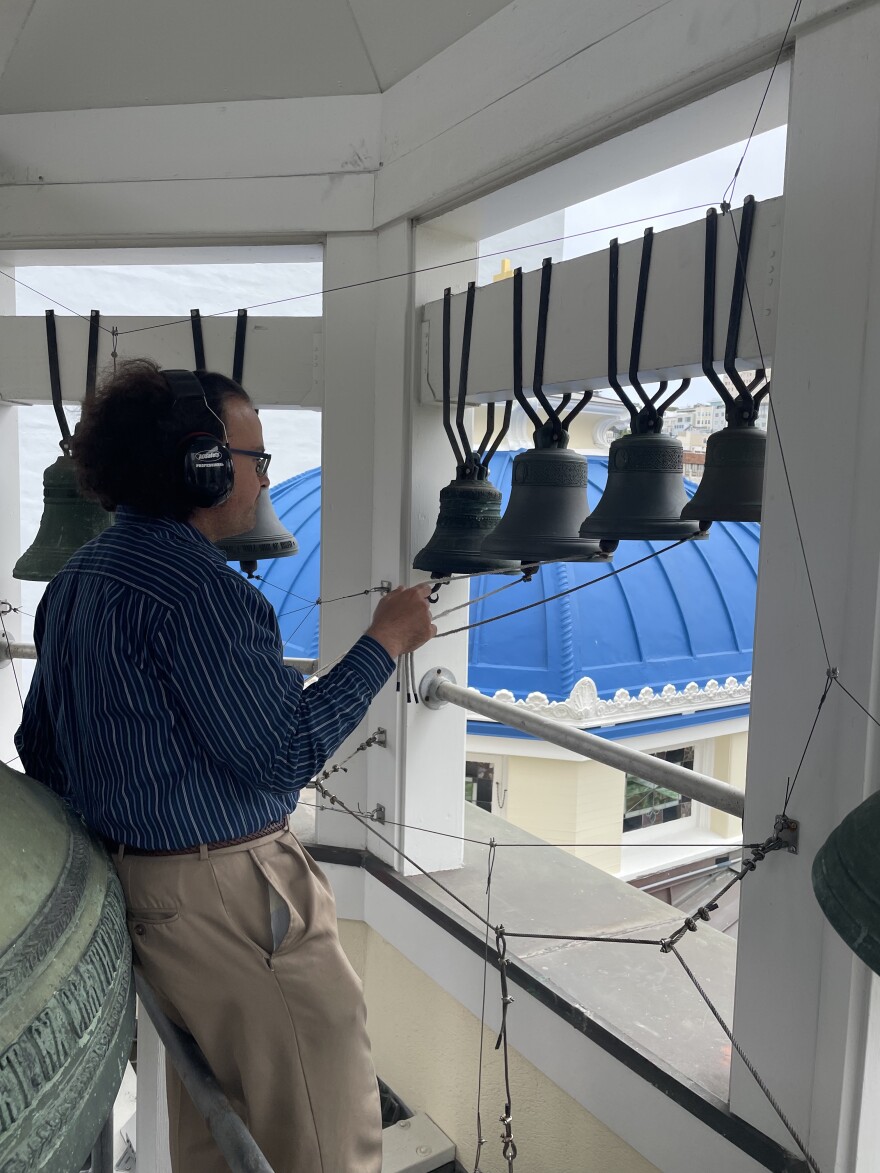 A man ringing church bells. 