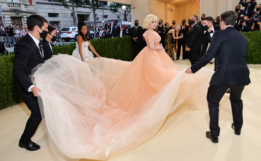 Co-chair Billie Eilish wears an Oscar de la Renta gown with a 15-foot train.