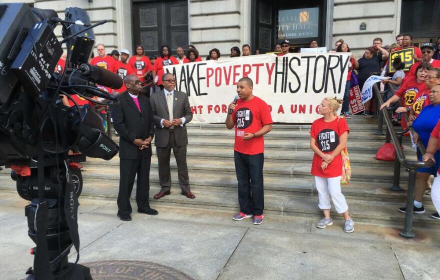Supporters of the minimum wage rally outside city hall after council votes the proposal down. [photo: Matt Richmond / ideastream]
