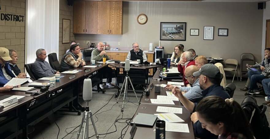 Kaweah Delta Water Conservation District General Manager Shane Smith, center, addresses concerns about recent water releases.