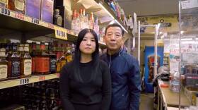 So Yun Um and her dad, Hae Sup Um at their liquor store. (Jacki Huntington)