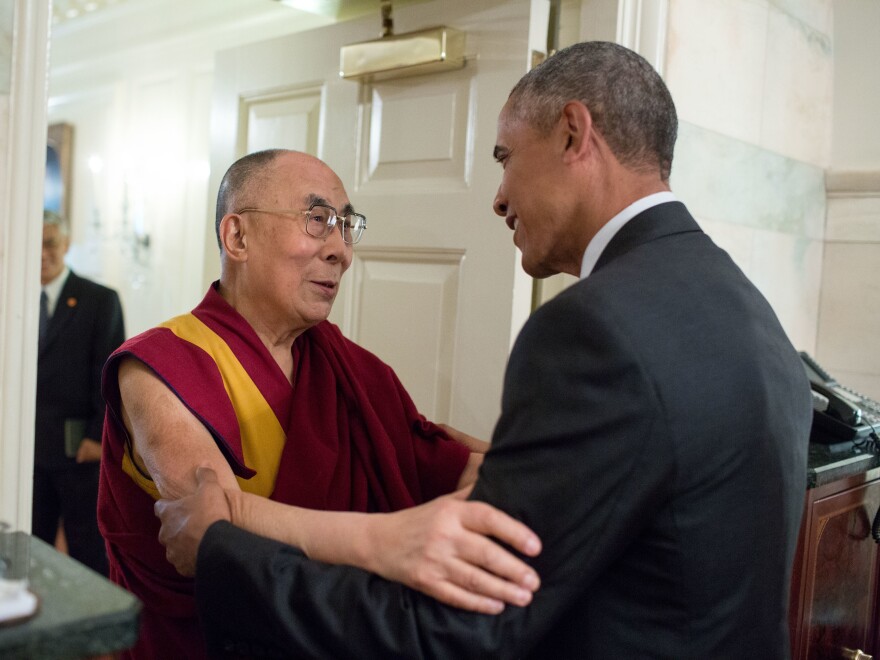 President Obama greets the Dalai Lama at the entrance to the Map Room of the White House Wednesday.