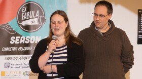 Rose Burrell, accompanied by spouse Nate and guide dog Pierce, at the Tales from Milwaukee Story Slam, March 2025.